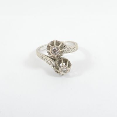 a close up of a silver ring on a white surface