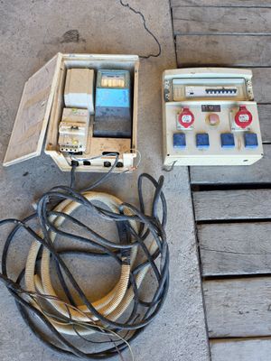 a box that has some wires and a phone in it