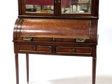 a small desk with a mirror on top of it