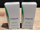 deux boîtes de savon Payot posées sur une table en bois
