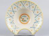 a white bowl with a blue and yellow design on it