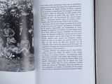 an open book with a black and white photo of a family