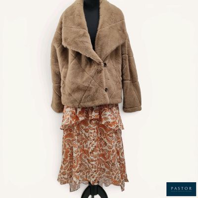a woman ' s jacket and skirt on a mannequin mannequin mannequin mannequin mannequin mannequin mannequin manne