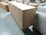 a large wooden cabinet in the middle of a room