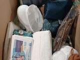a box full of toilet paper, toilet paper, and other items