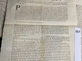 a piece of paper that is laying on top of a pile of papers
