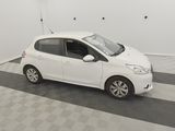 a picture of a small white car parked in a garage