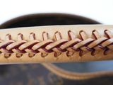 a close up of a baseball glove with a stitching on it