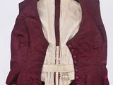 an image of a red vest with a white shirt underneath it