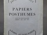 a close up of a book on a table with a black background