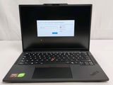 the laptop is open on a white surface with a keyboard