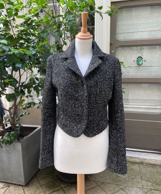 a black and white jacket on a mannequin mannequin mannequin mannequin mannequin mannequin mannequin mannequin mann