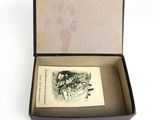 a small box with a drawing inside of it
