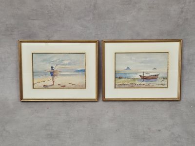 two framed watercolor paintings of a man fishing on the beach