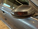 an image of a car door mirror with a sticker on it