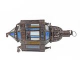 an old metal lantern with a stained glass window on it