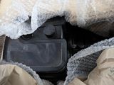 a box with a radio inside of it on the ground