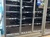 a picture of a refrigerator in a store with its doors open