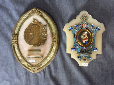 a picture of a picture of a man and a woman on a plaque