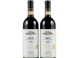 deux bouteilles de vin rouge posées l'une à côté de l'autre sur une surface blanche