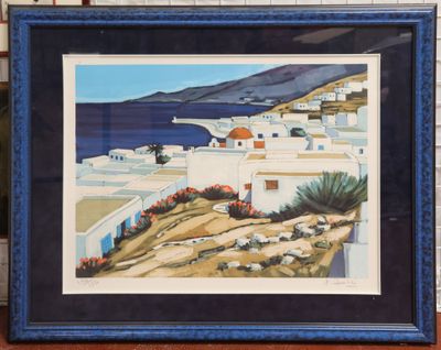 framed painting of a view of a village by the sea