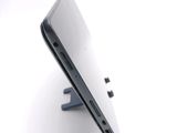a close up of a laptop on a stand on a white surface