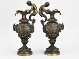 pair of antique bronze vases with a boy and a dog on them