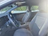 the interior of a car with two seats and a steering wheel