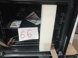 a note taped to the door of an oven