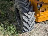 a tractor that is parked on the side of the road