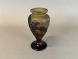 a small vase that is sitting on a table