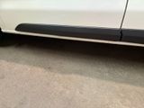 a close up of a white car with black trims