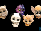 five small stuffed animals sitting next to each other on a black background