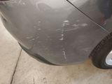 a close up of a car that has a denting on the side of it