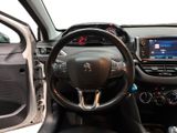 the interior of a car with a steering wheel and dashboard controls