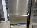 two stainless steel refrigerators sitting next to each other in a store