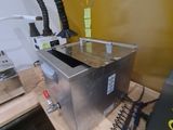 a machine that is sitting on top of a wooden table