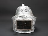 a silver helmet with a number on it on a table