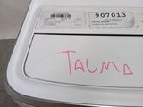 a small washing machine with a price tag on it