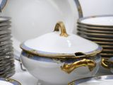 a lot of plates and bowls that are on a table