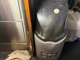 a trash can sitting next to a trash can on the floor