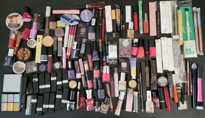 a lot of makeup and cosmetics products on the table