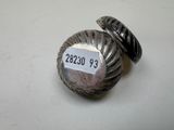 a close up of a ring on a table with a price tag