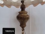 a lamp that is sitting on a table next to a wall