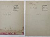 two old envelopes with stamps on them sitting on a table