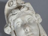 marble bust of a woman with a bird on her head
