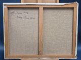 two paintings of a man and a woman are on display in a cardboard box