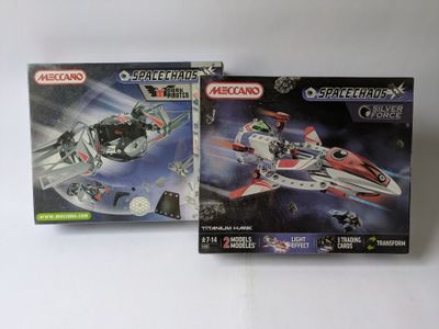 two boxed boxes of lego star wars action figures on a white surface