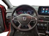 the interior of a car with a steering wheel and dashboard controls