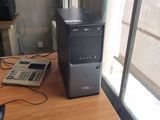 a desktop computer sitting on top of a wooden desk